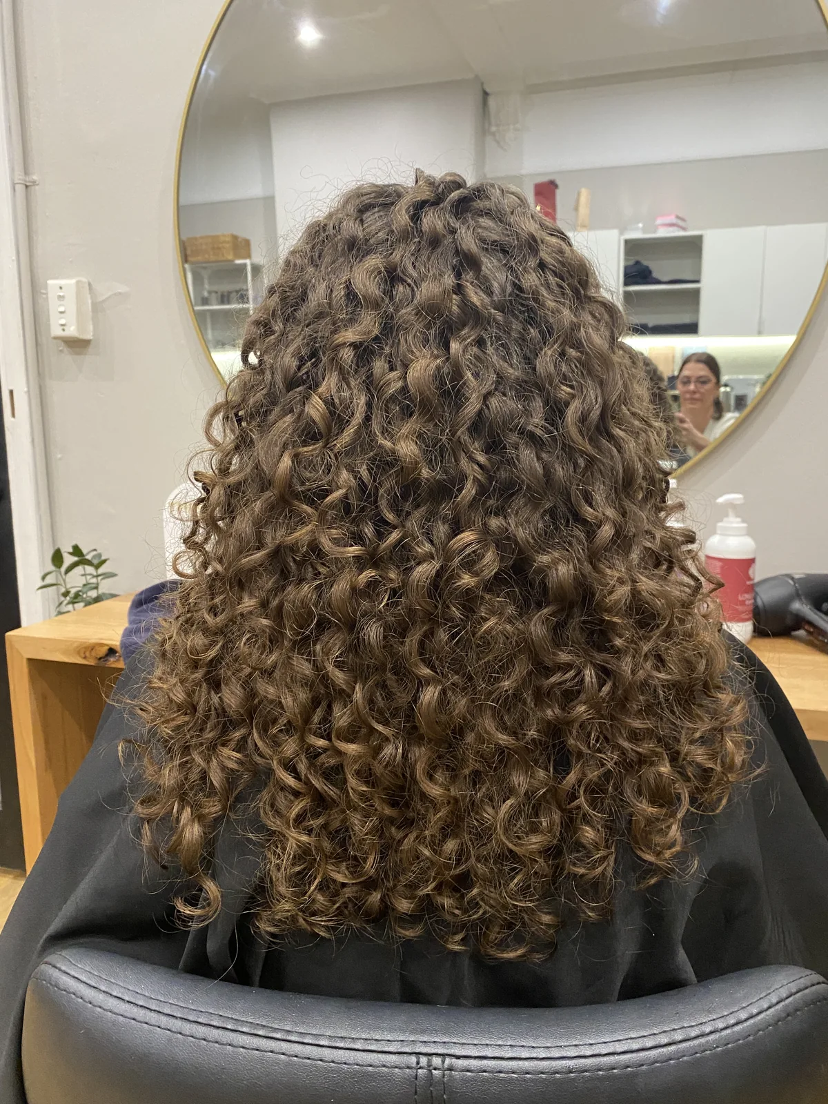 Long brunette curls defined and styled by Cas
